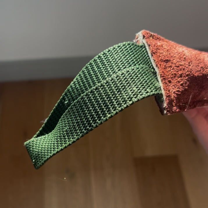 close up of leather tug toy