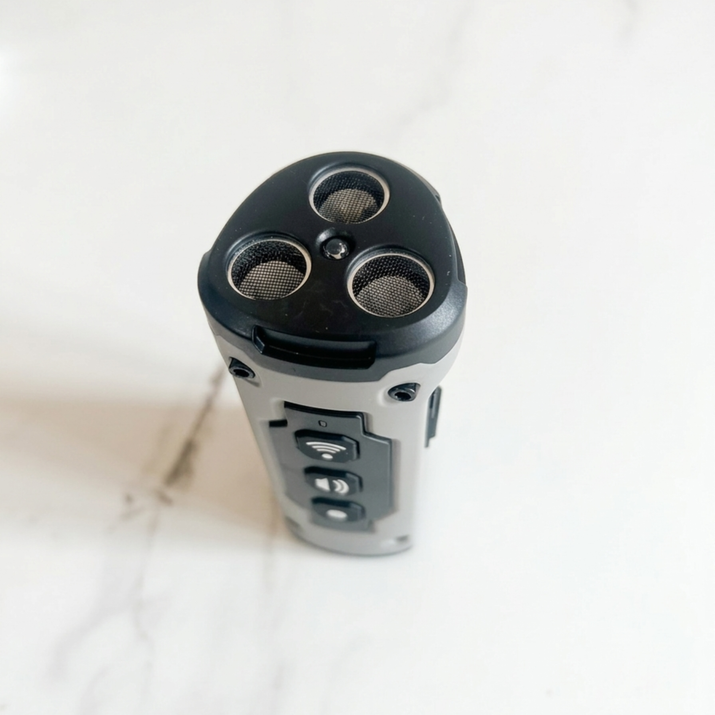 Black and gray barking device with multiple ports on a white background