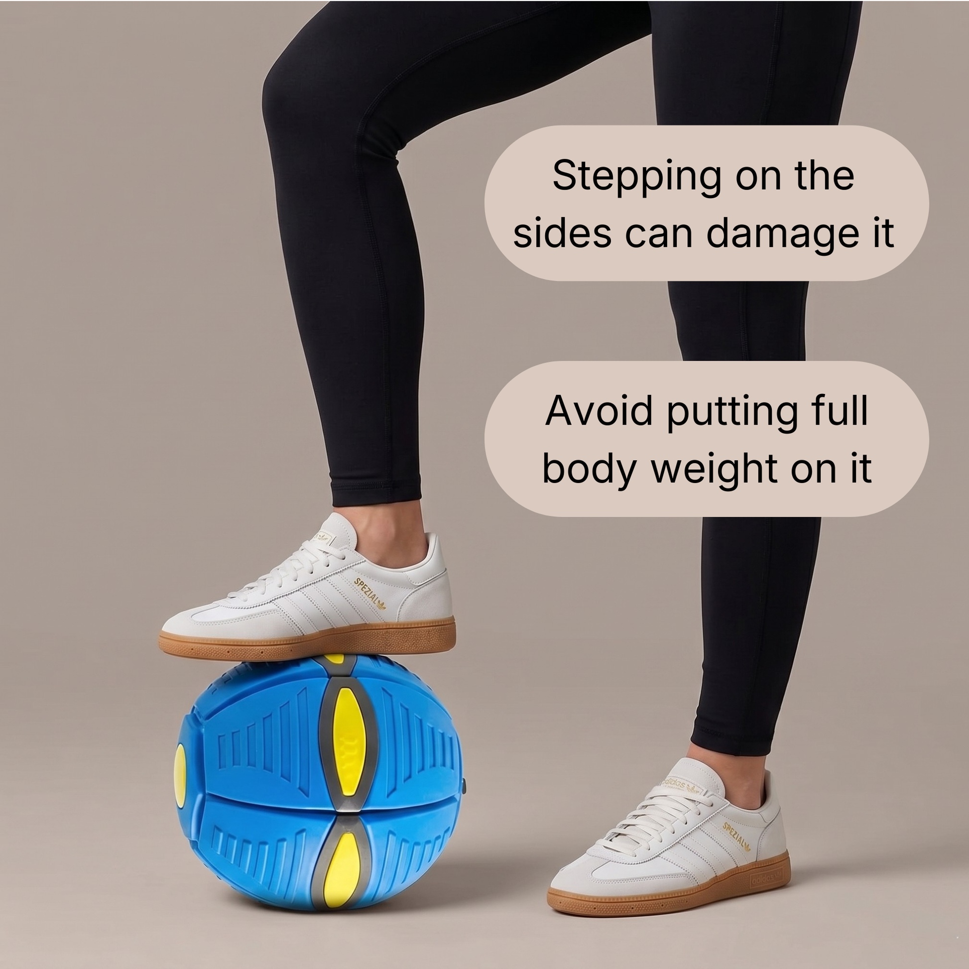 Person balancing on a blue dog ball with safety instructions displayed.
