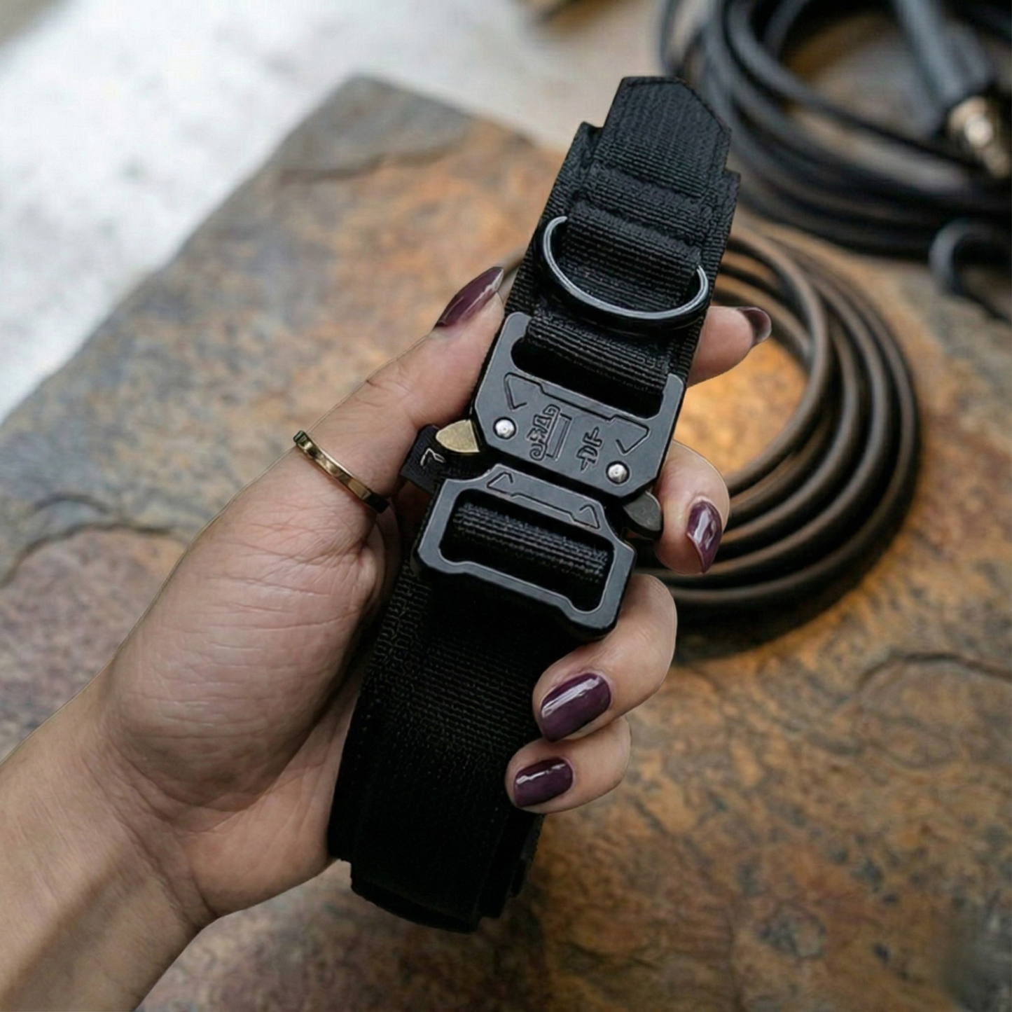 Woman hold black collar for reactive dogs